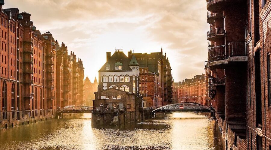 Sunset view of Hamburg’s Speicherstadt warehouses and canal, featured image for private Hamburg tours
