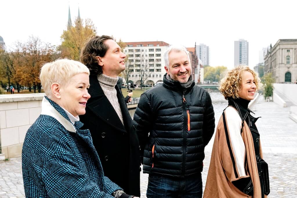 Humboldt Tours Berlin team with guests during a private tour, sharing local insight and history along the river in Berlin.