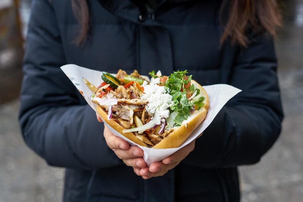 Fresh kebab-style street food with vegetables and cheese, a popular part of Berlin’s international food scene.