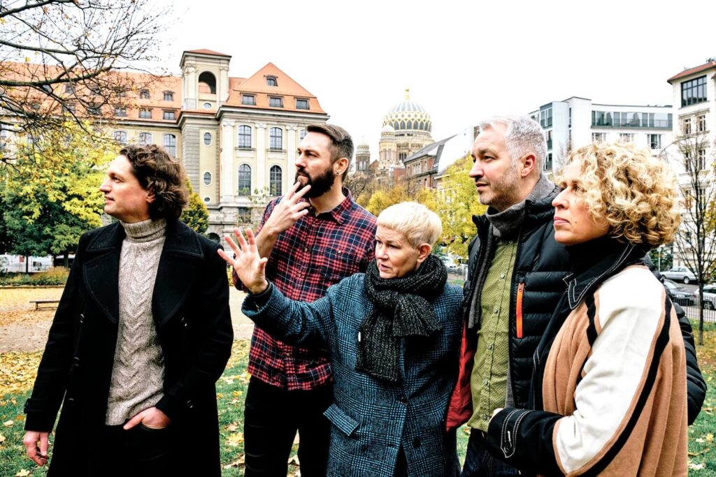 Private guide and travelers exploring Berlin’s Jewish history near the New Synagogue in the historic Jewish quarter.