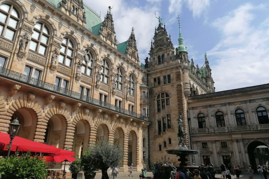 Courtyard of Hamburg City Hall with historic architecture and fountain