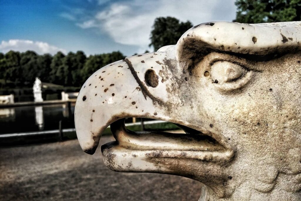 Close-up of a stone eagle sculpture in the gardens of Sanssouci Park