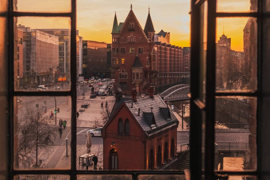 View over Speicherstadt and Hamburg’s historic harbor district from a warehouse window