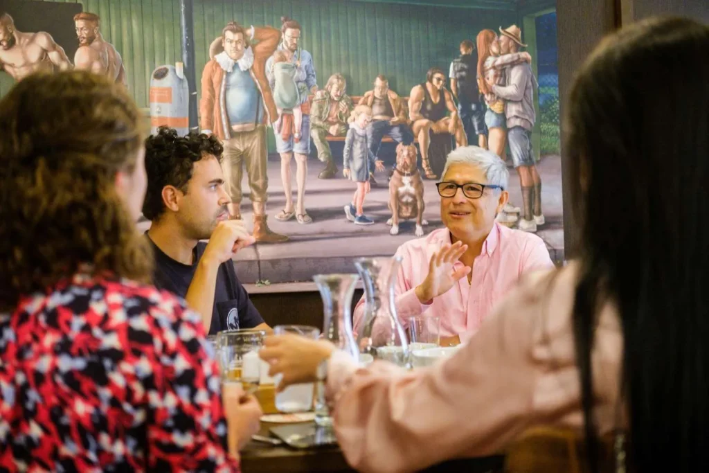 Guide sharing stories with guests during a Vienna restaurant stop