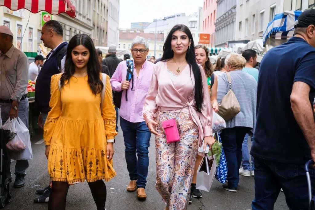 Guests walking through a local Vienna market during a food tour