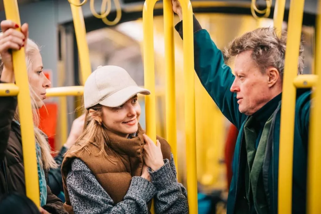 Guide and guests using public transport during a Vienna food tour