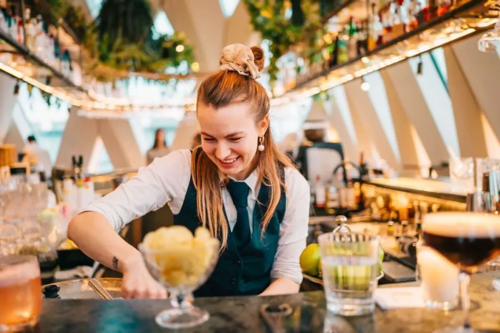 Bartender preparing cocktails during a Vienna nightlife tour stop