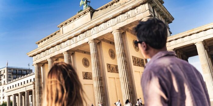 Visitors at the Brandenburg Gate in Berlin, a must-see landmark on a one-day Berlin itinerary