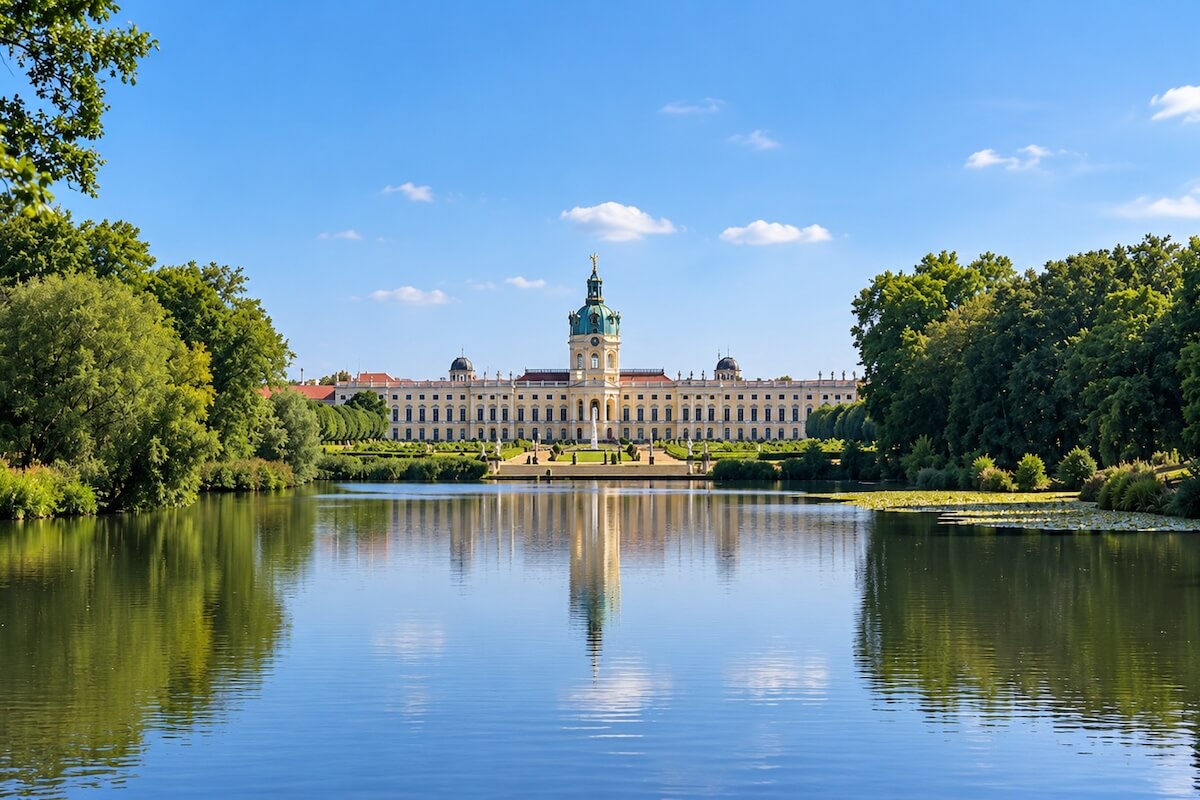 Charlottenburg Palace and gardens in Berlin reflected in the lake on a sunny day