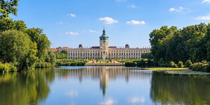 Charlottenburg Palace and its gardens reflected in the lake, one of Berlin’s historic landmarks